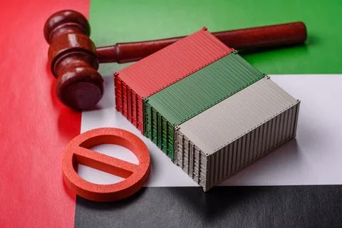 The cargo container ban on the UAE flag as a conceptual backdrop. The cargo.. Stock Photos
