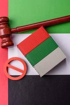 The cargo container ban on the UAE flag as a conceptual backdrop. The cargo.. Stock Photos