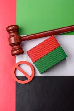 The cargo container ban on the uae flag as a conceptual backdrop. The cargo.. Stock Photos
