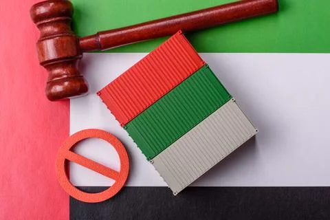 The cargo container ban on the UAE flag as a conceptual backdrop. The cargo.. Stock Photos