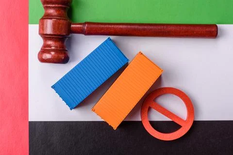 The cargo container ban on the UAE flag as a conceptual backdrop. The cargo.. Stock Photos