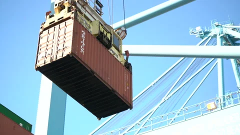 Cargo container being lifted by a crane Stock Footage 171591348