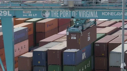 Cargo container being lifted from stack of containers Stock Footage 171591643