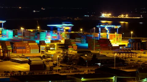 Cargo container hoisting cranes harbor traffic night timelapse Video stock 49970292