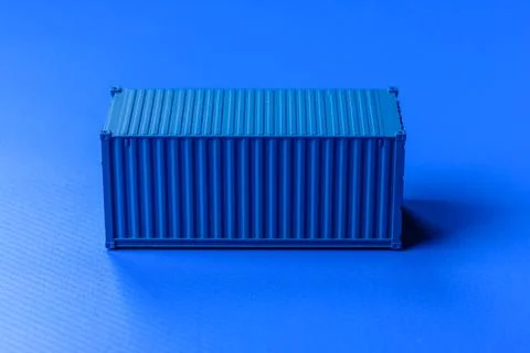 A cargo container in a port warehouse as a logistics element, export. A car.. Stock Photos