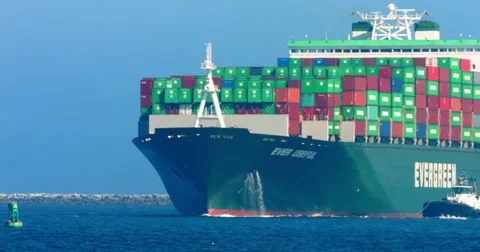 Cargo container ship and pusher tugs enter the sea port during the heat wave 4K Stock Footage
