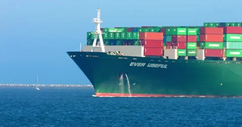 Cargo container ship and pusher tugs enter the sea port during the heat wave, 4K Stock Footage 67824618
