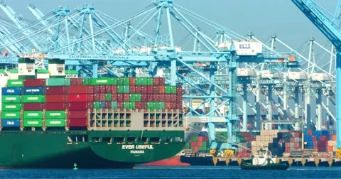 Cargo container ship and pusher tugs enter the sea port during the heat wave 4K Stock Footage 67824882