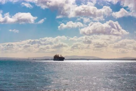 Cargo container Ship arriving into River Tagus Lisbon Port, Portugal Stock Photos