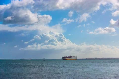 Cargo container Ship arriving into River Tagus Lisbon Port Stock Photos