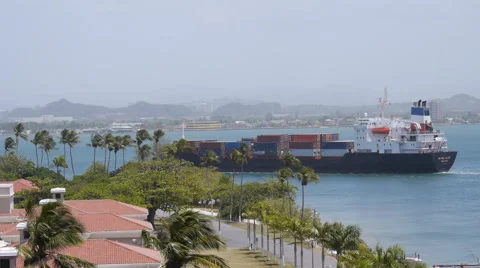 Cargo container ship close to Coast Guard Station Stock Footage 50490246