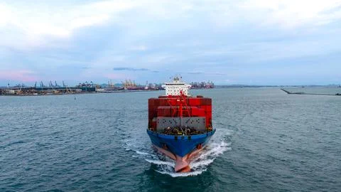 Cargo Container Ship Navigating Waters Delivering Freight Logistics Near La.. Stock Photos