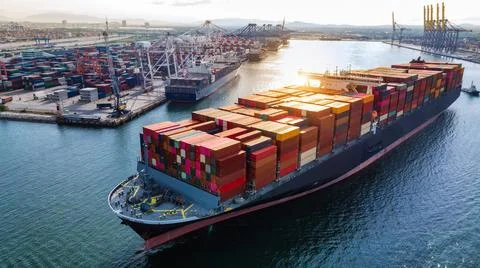 Cargo container ship  running out from international cargo sea port at mornin Stock Photos