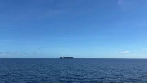 Cargo container ship sailing on the open ocean horizon Stock Footage 329459303