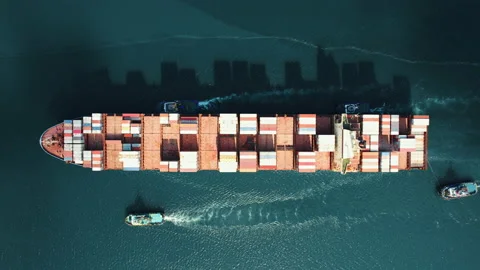 Cargo container ship is sailing to port Aerial view for unloading by pilots Stock Footage 160366014