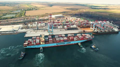 Cargo container ship is sailing to port for unloading accompanied by pilots Stock-Footage 160366417