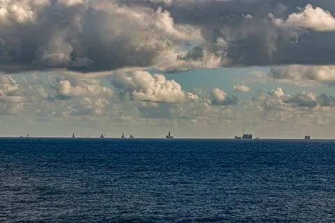 Cargo container ships are waiting to enter the port. Stock Photos