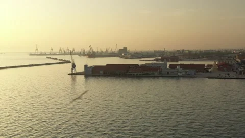 Cargo container transport ship and cranes at port industrial, sunset Stock Footage 224768409