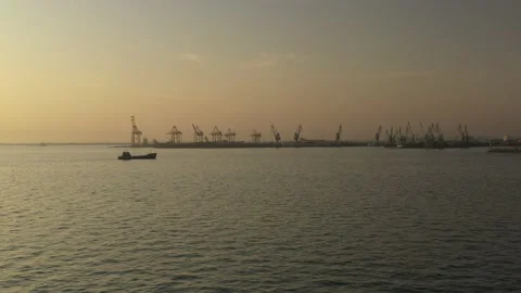 Cargo container transport ship and cranes at port industrial, sunset Stock Footage 224768414