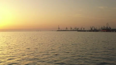 Cargo container transport ship and cranes at port industrial, sunset Stock Footage 224772308