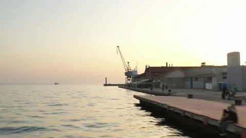Cargo container transport ship and cranes at port industrial, sunset Stock Footage 224773594