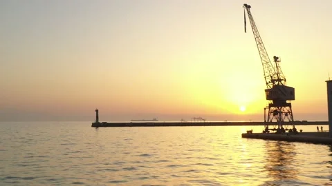Cargo container transport ship and cranes at port industrial, sunset Stock Footage 224773622
