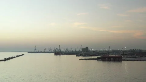 Cargo container transport ship and cranes at port, sunset in thessaloniki Stock Footage 224777108