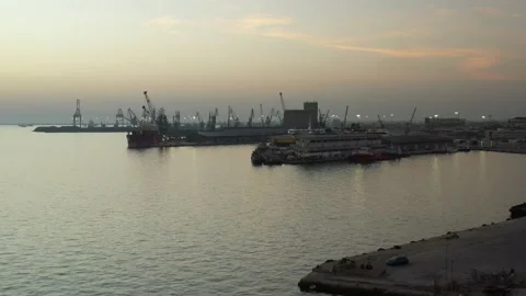 Cargo container transport ship and cranes at port industrial, sunset Stock Footage 224777535