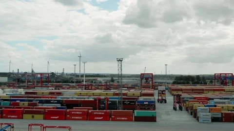 Cargo containers are stacked in a shipping yard Stock Footage 312537798