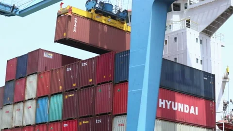 Cargo containers being loaded at a busy port during the day Stock Footage 318201788