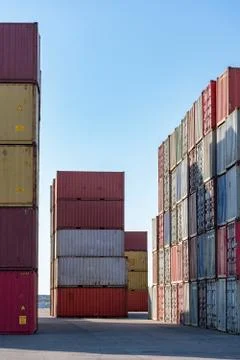 Cargo containers for export and import in maritime terminal. Stock Photos