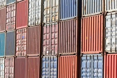 Cargo containers for export and import in maritime terminal. Stock Photos