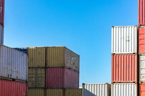 Cargo containers for export and import in maritime terminal. Stock Photos