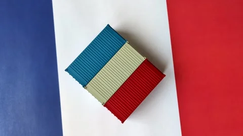 Cargo containers on the French flag as a conceptual backdrop for goods export an Stock Footage 346552036