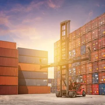 Cargo containers in shipping yard for import,export industrial Photos