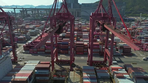 Cargo containers stacked during unloading at shipping dock Stock Footage 334115397