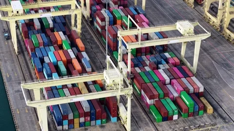Cargo containers stacked high at container terminal Stock Footage 337982157