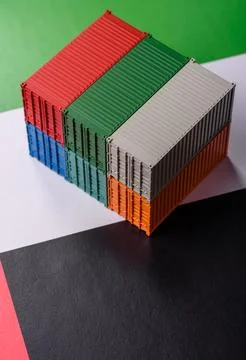 Cargo containers on the UAE flag as a conceptual backdrop for goods export... Stock Photos