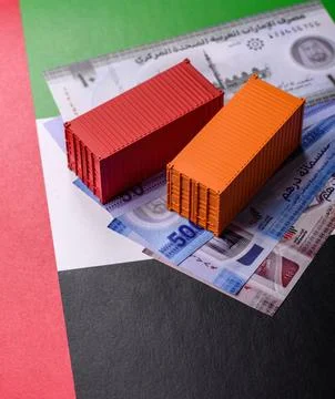 Cargo containers on the UAE flag as a conceptual backdrop for goods export... Stock Photos