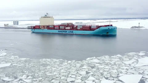 Cargo contaiter ship goes through the ice floe near the dam Stock-Footage 170385029