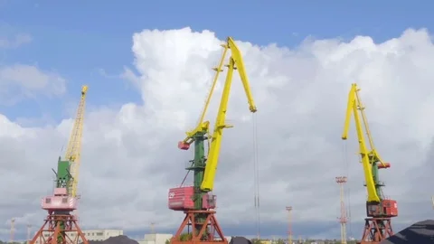 Cargo crane, freight train and coal in port. Cranes at the container port ter Stock Footage