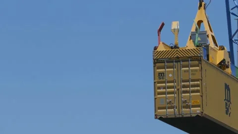 Cargo crane loading 40 feet container to ship 4k Stock Footage 154384836
