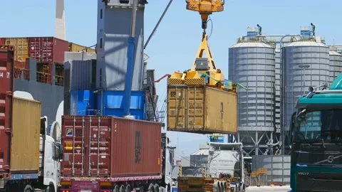 Cargo crane loading 40 feet container to ship 4k Stock Footage 154385212