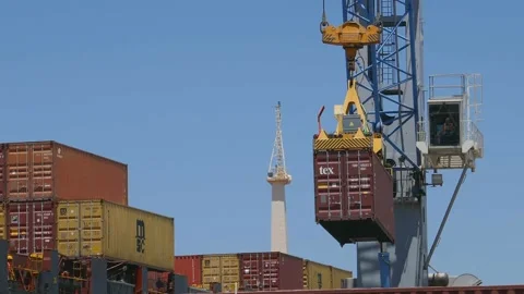 Cargo crane loading 40 feet container to ship 4k Stock Footage 154385224