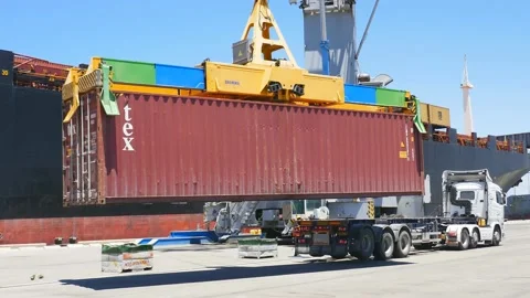 Cargo crane loading 40 feet container to ship 4k Stock Footage 154385225