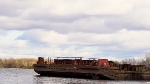 A cargo crane loads sand onto a barge Stock Footage 117860322
