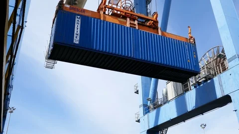 Cargo crane moves a blue cargo container 4k intro video for business Stock Footage 104508650