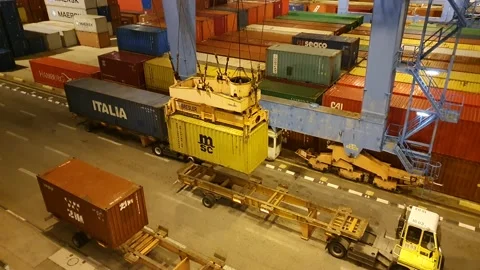 Cargo crane moves a yellow cargo container night MSC 4K Stock Footage 130206352
