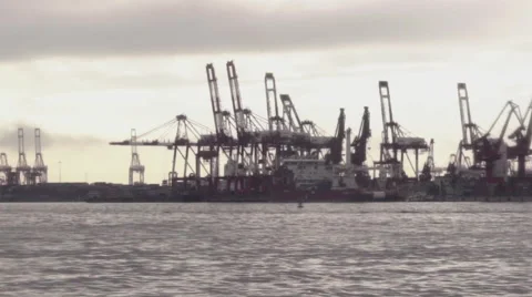Cargo Cranes from Ocean with Boat Видео 61064952