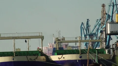 Cargo Cranes Working In Harbor In Distance, Ship HD Stock Footage 76400651